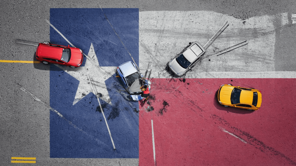 Gen4-graphicTexasflagwithcaraccidents | V.Valenzuela Law Aerial view of a multi-car crash on a color-blocked road, with a red car on the left, a blue car center, a white car nearby, and a yellow car on the red section; two people stand near the blue car amid scattered debris.